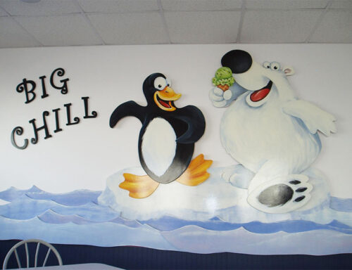 A wall mural with a penguin and a polar bear eating a cone of green ice cream at Brennan's Big Chill in Bloomsburg, PA.