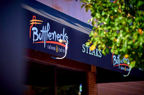 Exterior awning signage for Bottlenecks Saloon & Eatery in West Hazleton, PA.