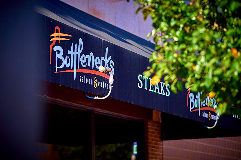 Exterior awning signage for Bottlenecks Saloon & Eatery in West Hazleton, PA.