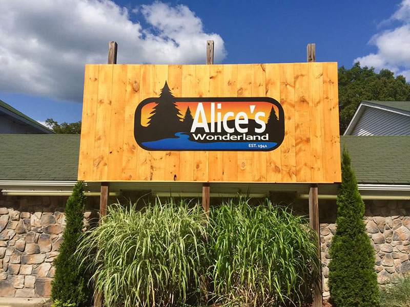 Exterior signage featuring Alice's Wonderland logo in Greeley, PA.
