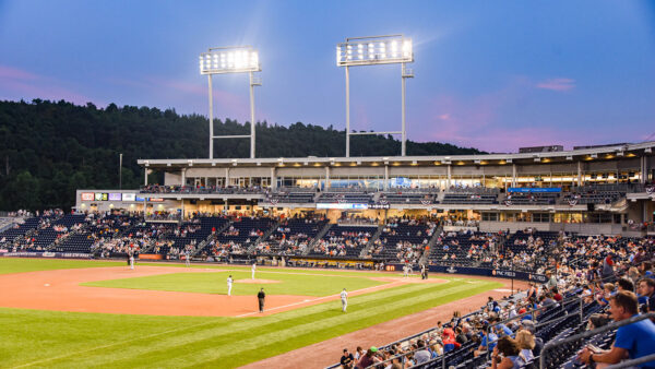 A photo of the Scranton/Wilkes-Barre RailRiders on the field during a night game under the lights at PNC Field in Moosic, PA.