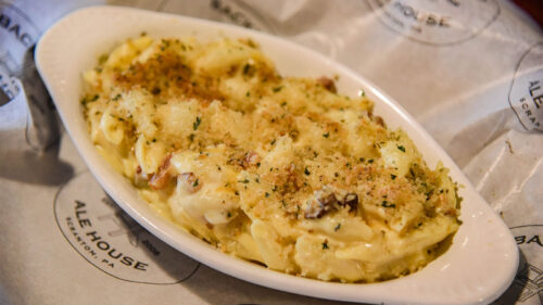 A breadcrumb-topped bowl of mac & cheese sits on a table at Backyard Ale House in Scranton, PA.