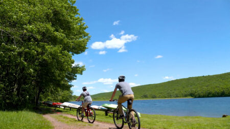 Two cyclists take to the lakeside trail at Mauch Chunk Lake Park in Jim Thorpe, PA.