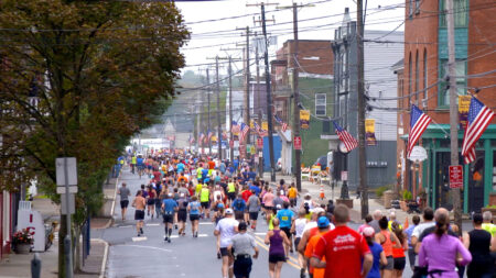A view of runners making their way down a city street during the Steamtown Marathon in Scranton, PA.