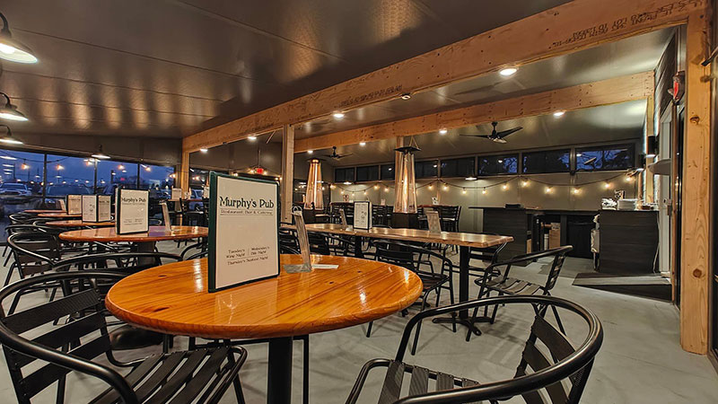 The enclosed patio with wood detailing and black metal detailing at Murphy's Pub in Swoyersville, PA.