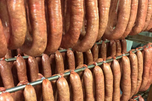 Rings of smoked Kielbasi hang on racks at Schiff's Marketplace in Forty Fort, PA.