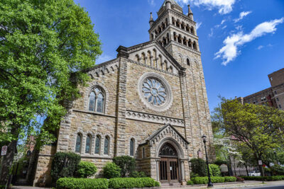 The bell tower and large circular stained glass window at the entrance of St. Stephen's Episcopal Church in Wilkes-Barre, PA.
