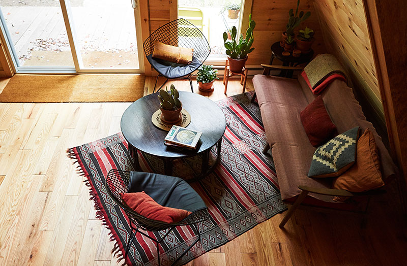An overhead shot of the living room inside of a rental cabin at Camp Caitlin in Honesdale, PA.