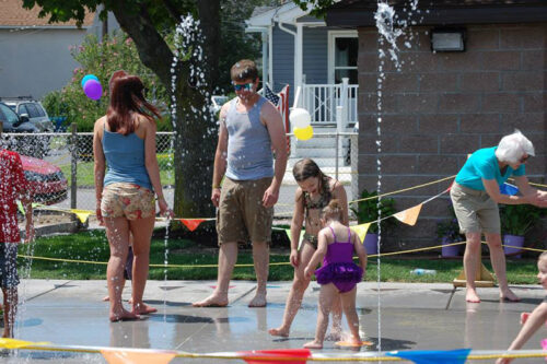 Kids and their parents playing at the splash pad at Sherwood Park in Dunmore, PA.