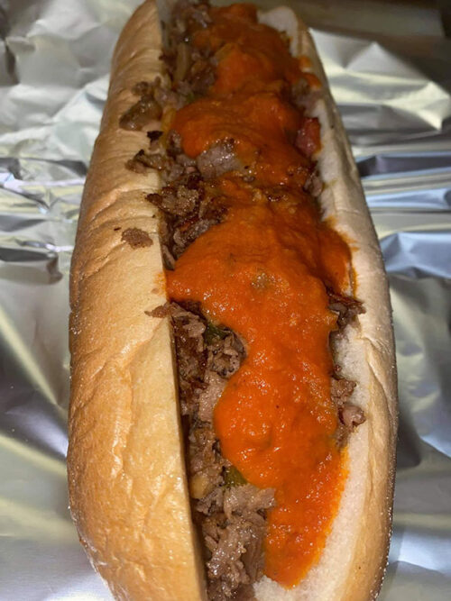 A cheesesteak with a red sauce on top from Coal Miners Bar & Grill in Lansford, PA.
