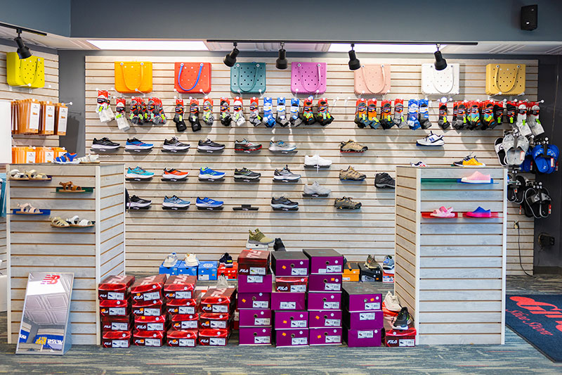 A wall displays children's shoes, socks, and bags at Gino's Shoe Store, located in Mountain Top and Dallas, PA.