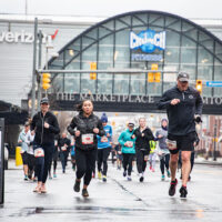 Scranton Half Marathon runners pass the mile 6 marker at The Marketplace at Steamtown in downtown Scranton, PA.