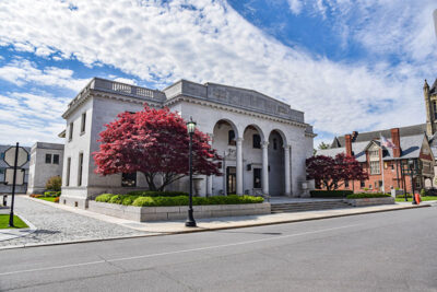 Red maple trees flank the entrance of the Kirby Health Center in Wilkes-Barre, PA.