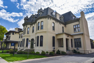 Rifkin Hall, a yellow stucco Gothic mansion in Wilkes-Barre, PA.