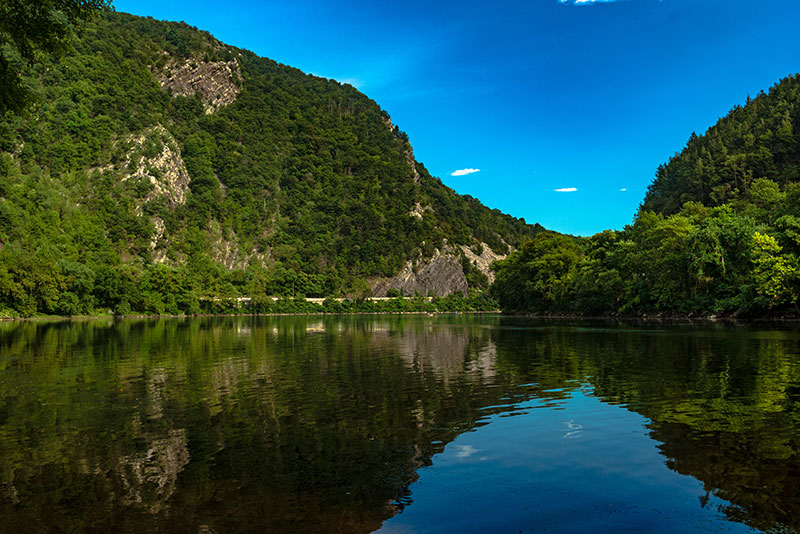The Delaware River flowing through the rugged mountains of the Delaware Water Gap in Delaware Water Gap, PA.