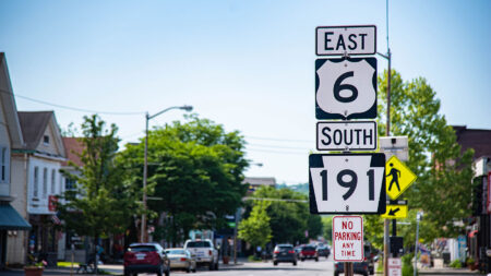 Street view of road signs indicating 