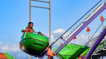 A mother and daughter ride the ferris wheel at the Luzerne County Fair in Dallas, PA.