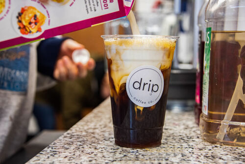 A barista mixes up a cold brew drink at Drip Coffee Company in Pittston, PA.