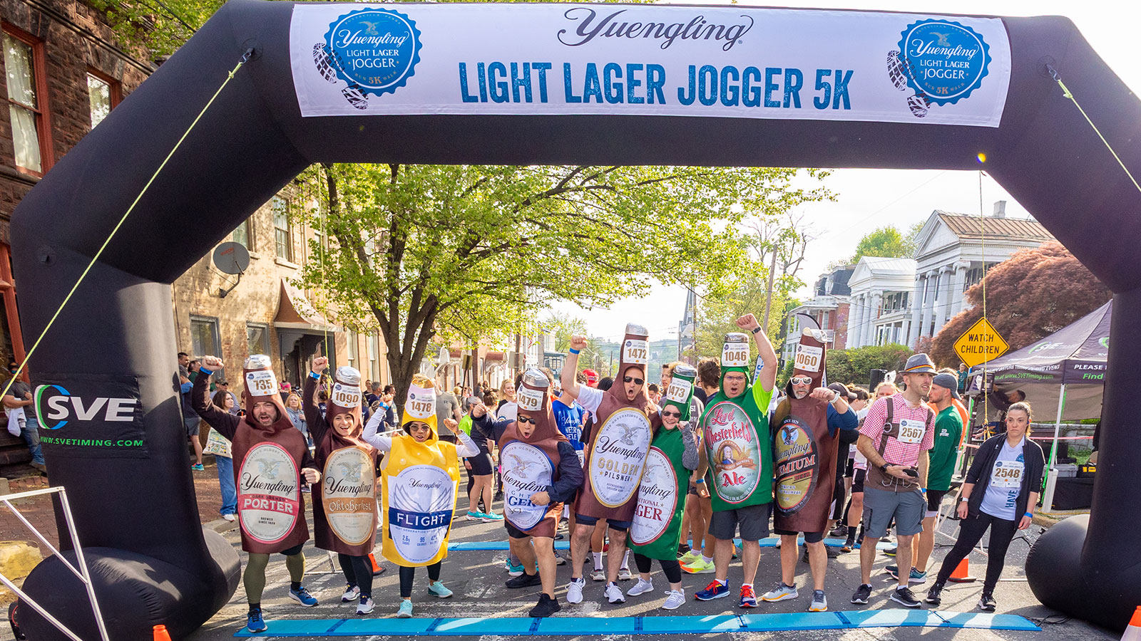 A group of runners, some dressed in beer costumes at the Yuengling Lager Jogger in Pottsville, PA.
