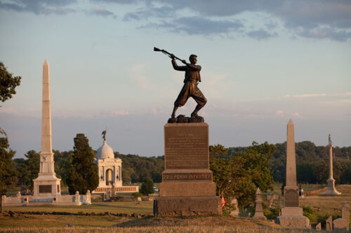 An aerial photo of the town of Gettysburg, PA with the iconic war statue in the center.