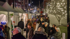 Patrons shopping at the Lackawanna Winter Market on Courthouse Square in Scranton, PA.