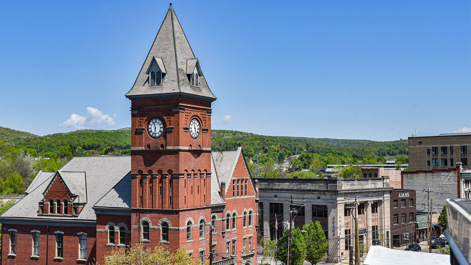 The historic Carbondale City Hall and Courthouse building, showcasing its brick facade and clock tower against a blue sky