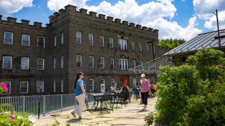 Patrons sit outside Cocoon Coffee House at Hawley Silk Mill, Hawley, PA.