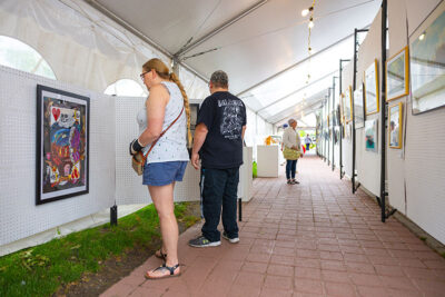 Fine Arts Fiesta attendees check out the art exhibits under the tents on Public Square in Wilkes-Barre, PA.