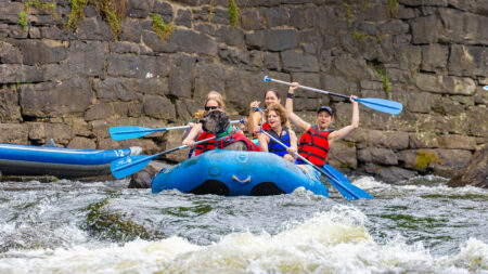 Rafters enjoying a day out on the water with their dog at Pocono Whitewater.