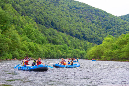 A few groups of whitewater rafters paddles their way down the Lehigh River in Jim Thorpe, PA.