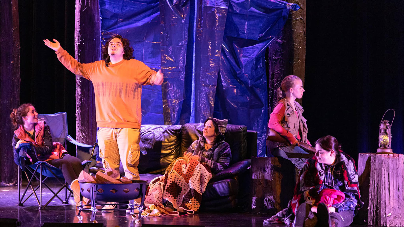 An actor stands among a group of seated actors during a performance of a play on stage at the Scranton Fringe Festival in Scranton, PA.