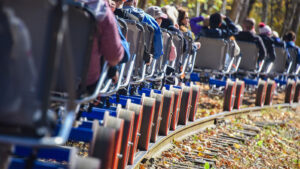 A line of rail bikes roll along the tracks along the Lackawaxen River at Pennsylvania Rail bikes in Hawley, PA.