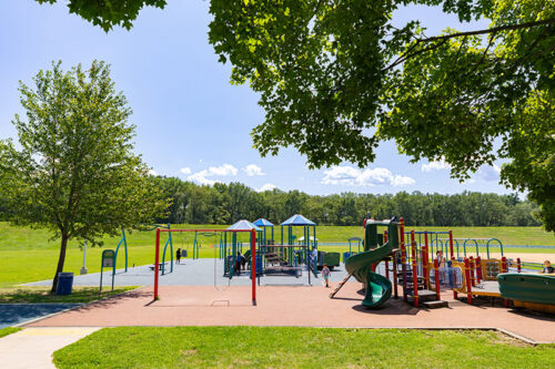 A few children run around at the colorful, inclusive playground at Kirby Park in Wilkes-Barre, PA.