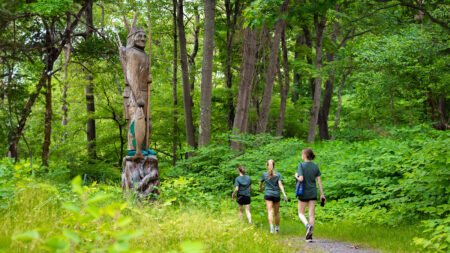 Three women walking along the Lackawanna River Heritage Trail in Scranton, PA, a popular outdoor activity in Northeastern PA.