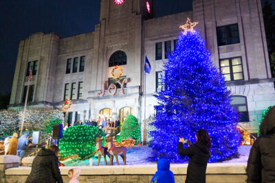 The Hazleton City Halls Christmas Tree Lighting displays a glowing blue Christmas tree in front of Hazleton City Hall in Hazleton, PA.
