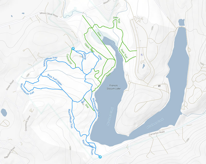 A trail map of the Frances Slocum State Park in Wyoming, PA. The map shows a network of hiking trails, including the blue-marked Maconaquah Trail, which loops around the lake, and the green-marked Deer Trail, which forms a smaller loop in the northern part of the park.