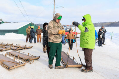 A man pays for his sled at the Eagles Mere toboggan slide in Eagles Mere, PA.