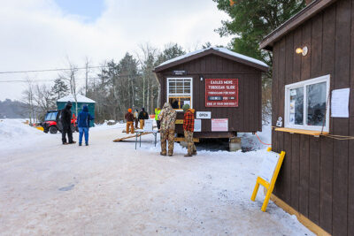 Participants pay for toboggan rides at the Eagles Mere toboggan slide in Eagles Mere, PA