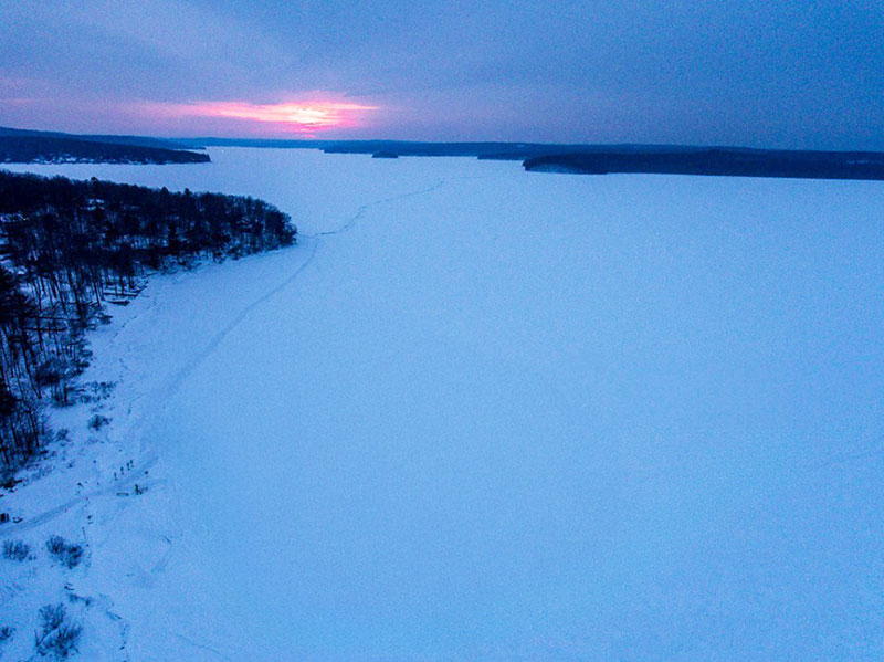 Image of sunset over frozen Lake Wallenpaupack in Hawley, PA