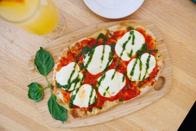Top view of flatbread pizza on table inside the Winter Garden restaurant at Elk Mountain in Union Dale, PA.