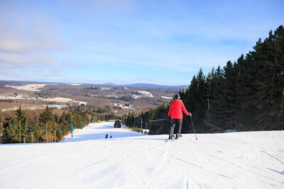 Point of view image of woman skiing down a trail at Elk Mountain in Union Dale, PA.