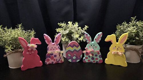 A decorated set of wooden bunnies at Wonderland Madhouse in Tannersville, PA.