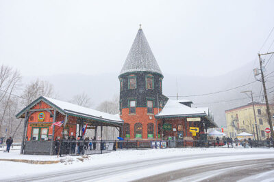 A snowy scene outside the train station during Winterfest in Jim Thorpe, PA