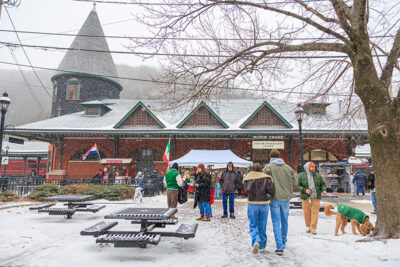 A snowy scene outside the train station during Winterfest in Jim Thorpe, PA
