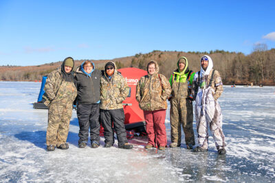 A group of anglers standing on the ice during Nanticoke Conservation Club's Ice Fishing Derby at Frances Slocum State Park in Wyoming, PA.