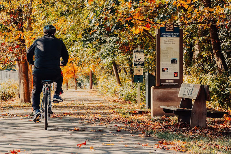 A man rides his bike on the Lackawanna River Trail in Lackawanna County, PA.