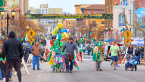 A street vendor walks down the street at the Pittston St. Patrick's Day Parade in Pittston, PA.