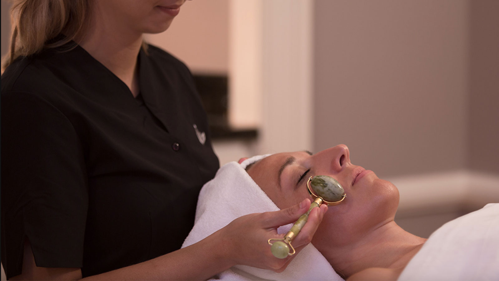 A woman getting a relaxing facial at The Lodge at Woodloch in Hawley, PA.
