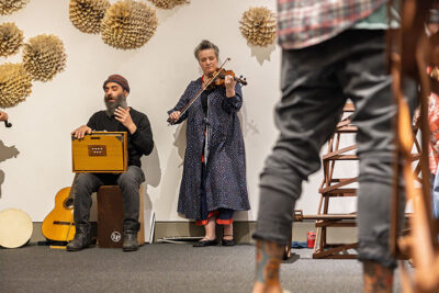 A man and woman play music at the Everhart Museum in Scranton, PA.