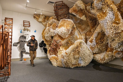 A man admires pieces of art as he walks through a gallery at the Everhart Museum in Scranton, PA.